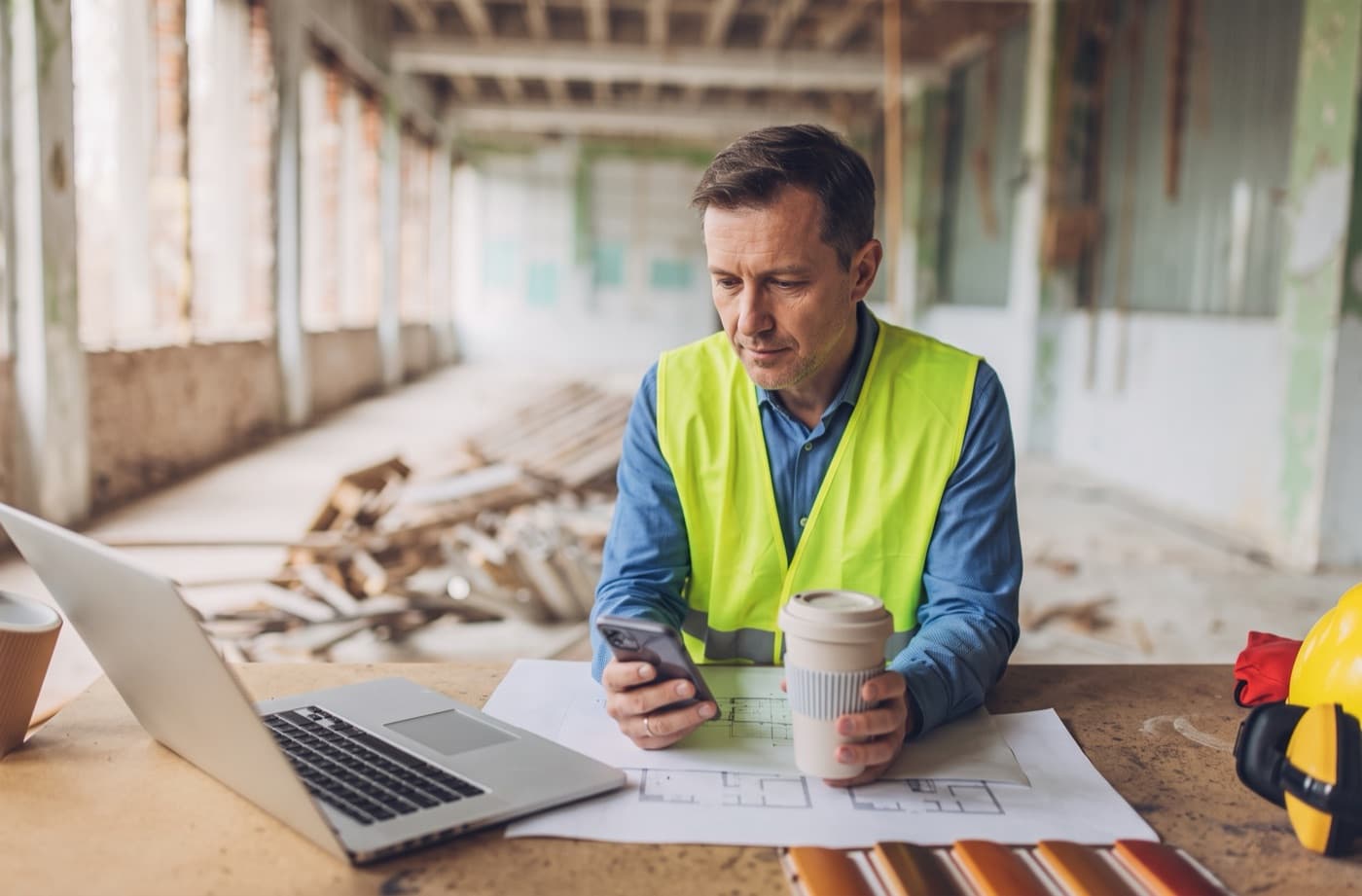 Contractor reviewing project details on a jobsite